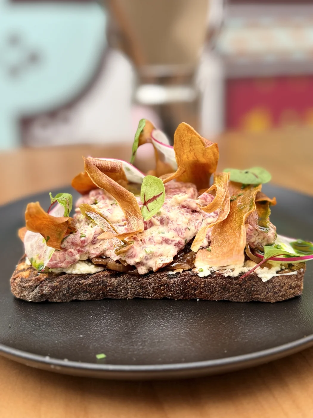 Tartare toast on dark plate