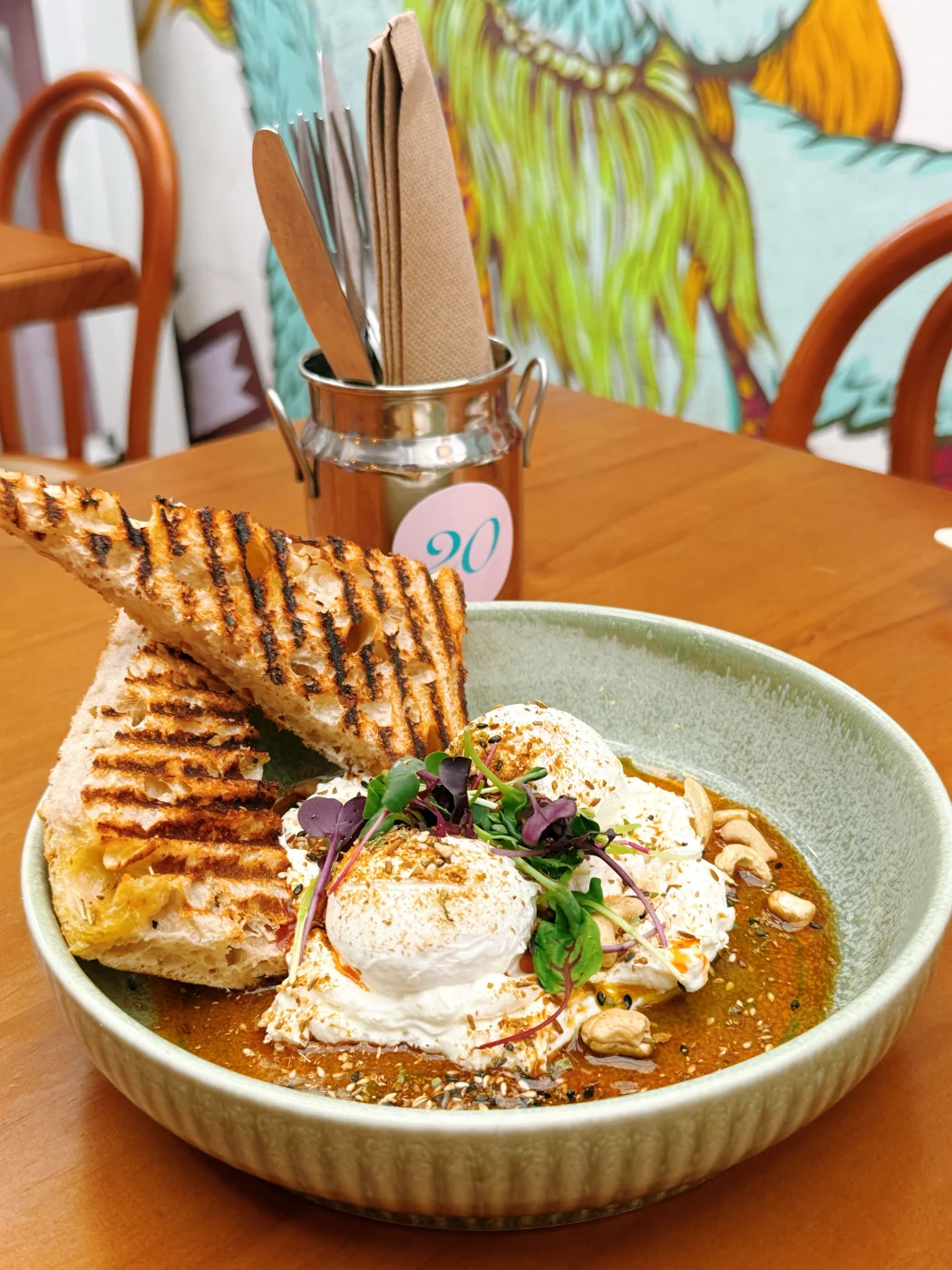 Eggs benedict with harissa and grilled toast